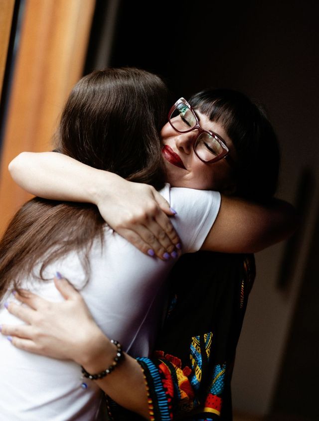 Kasia sharing a hug with a client